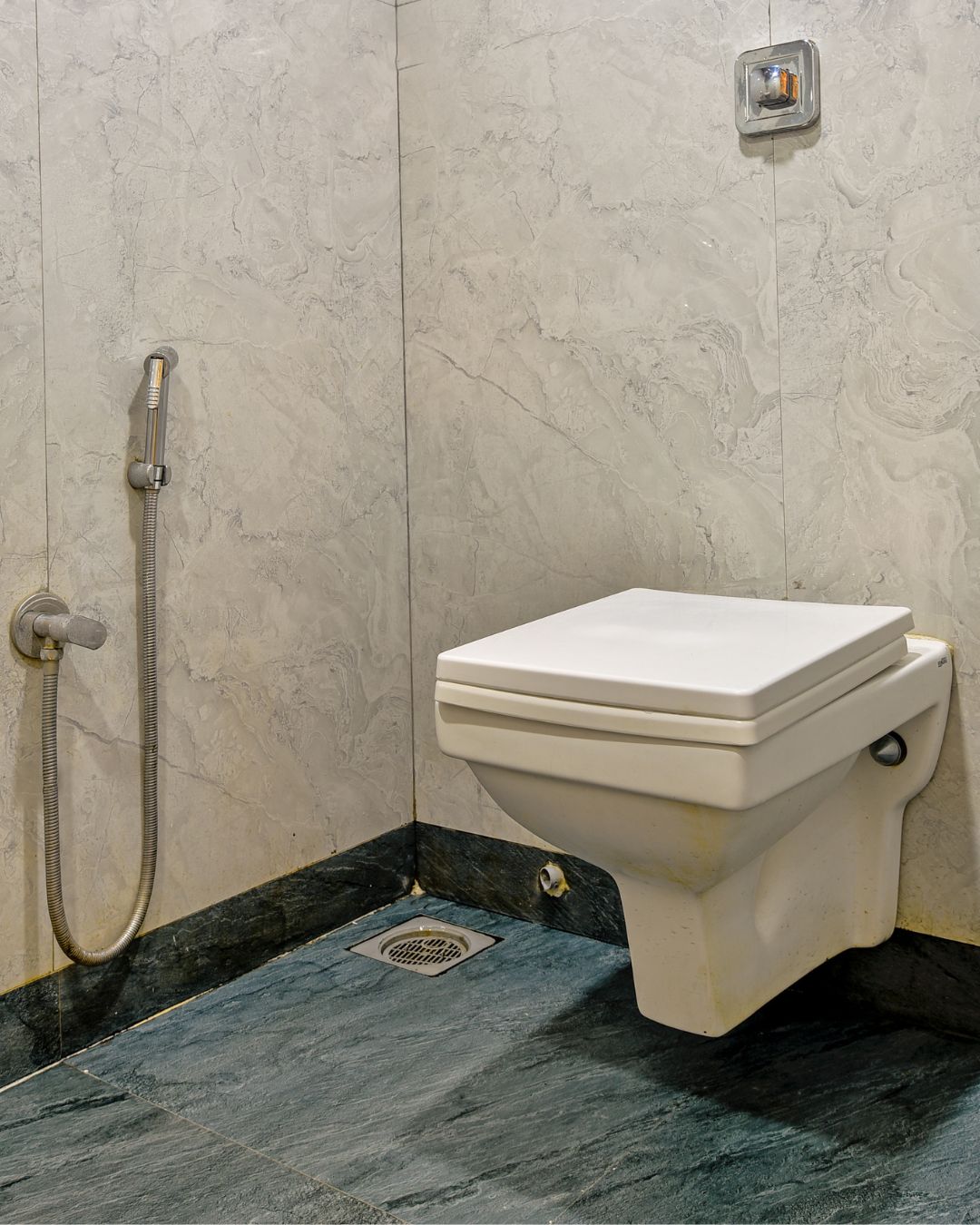 Modern marble-finished attached bathroom