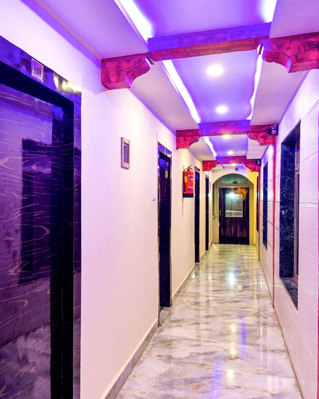 Clean hotel corridor with marble flooring